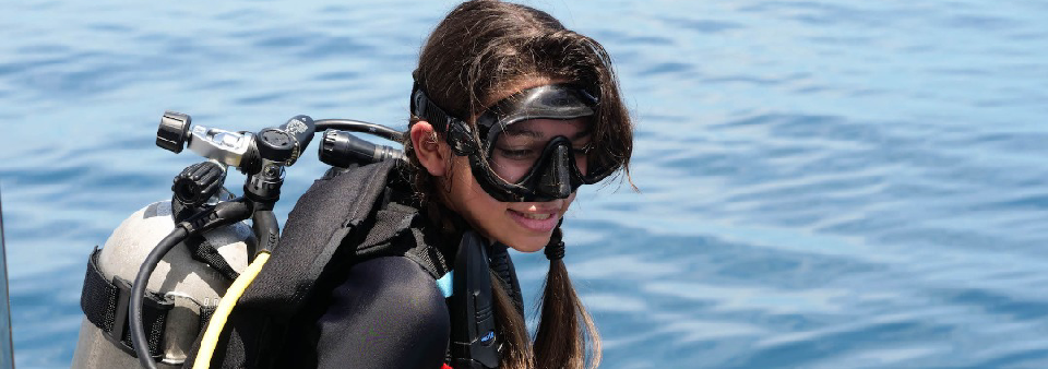 Happy couple diving in clear Mauritian waters.